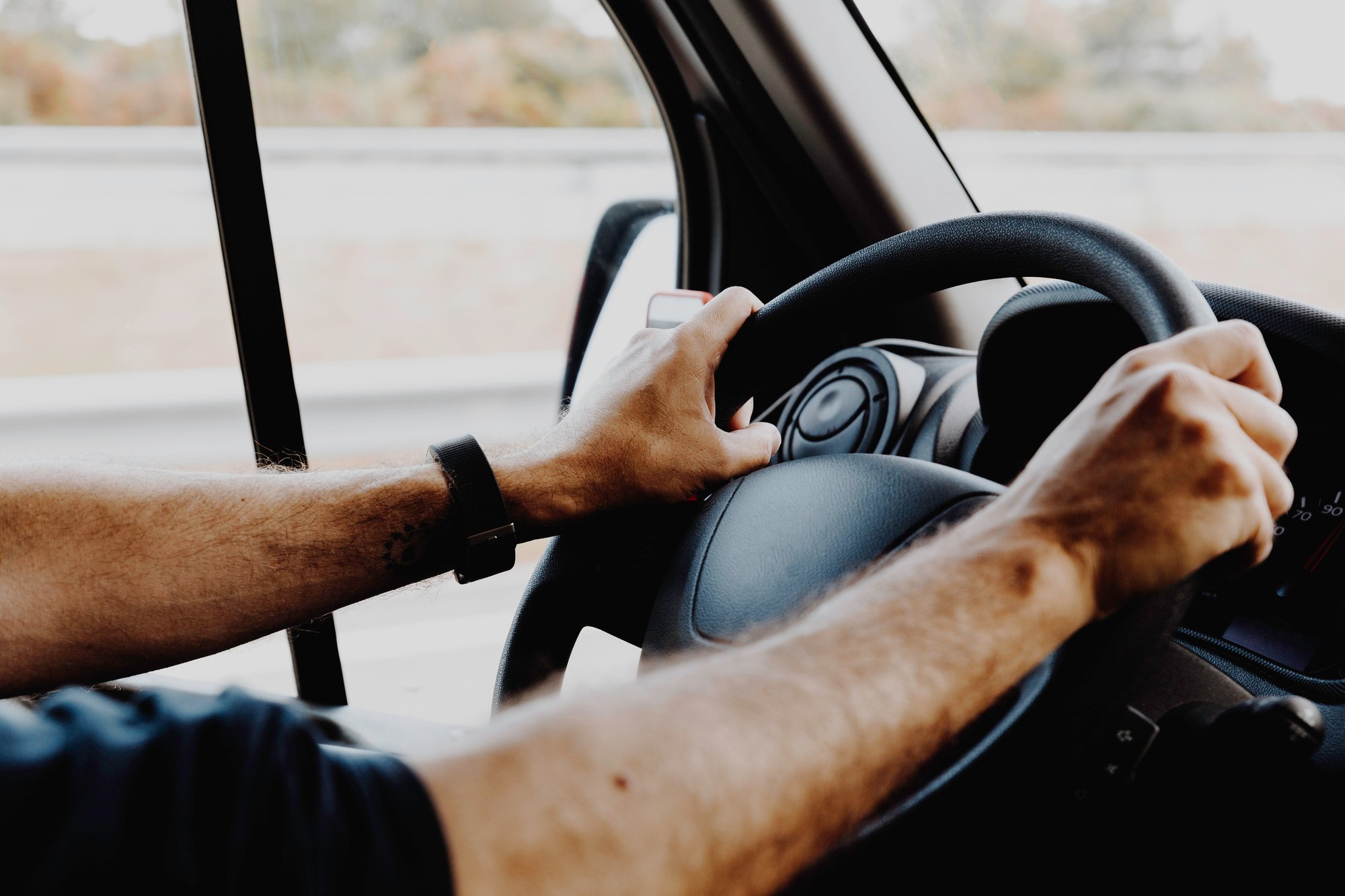 Man Holding Steering Wheel Man Holding Steering Wheel